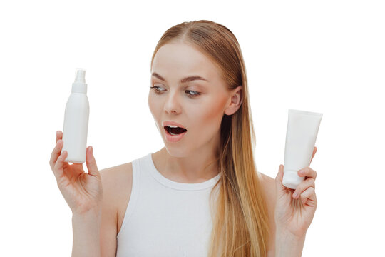 Perfect skin nude make up blue eyes hold bottle of shampoo isolated on pastel white background studio portrait. Skin care healthcare cosmetic procedures concept.