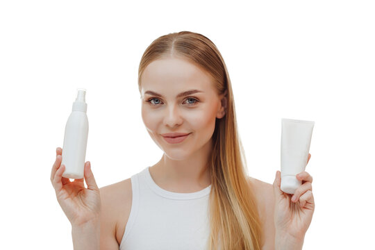 Perfect skin nude make up blue eyes hold bottle of shampoo isolated on pastel white background studio portrait. Skin care healthcare cosmetic procedures concept.