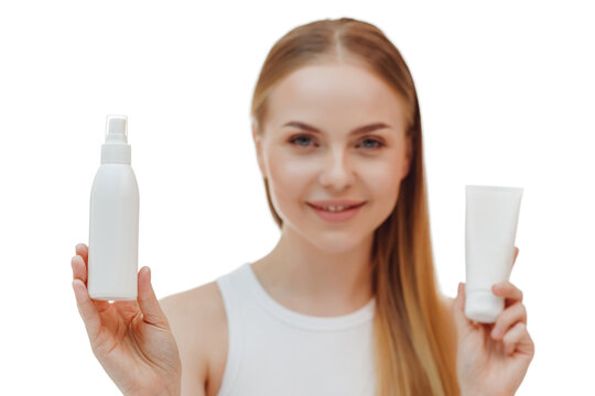 Perfect skin nude make up blue eyes hold bottle of shampoo isolated on pastel white background studio portrait. Skin care healthcare cosmetic procedures concept.