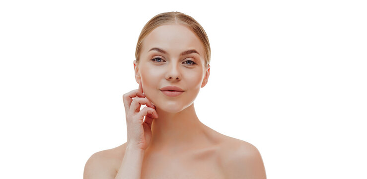 Beauty skin. Head and shoulders of blond woman model, touching glowing, hydrated facial skin, apply toner, skin cream or lotion for healthy look, after shower portrait, white background.