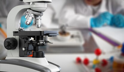 Modern microbiology microscope on table in laboratory,