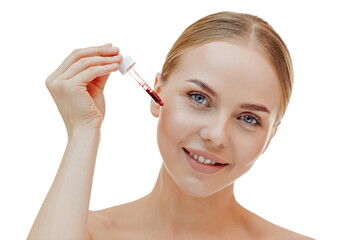 Fototapeta premium Beauty woman with freckles, naked shoulders and nude face, apply serum vitamin c, argan oil tea tree ingredients in pippette dropper under eye, treating skin for nourishing and moisturizing effect.