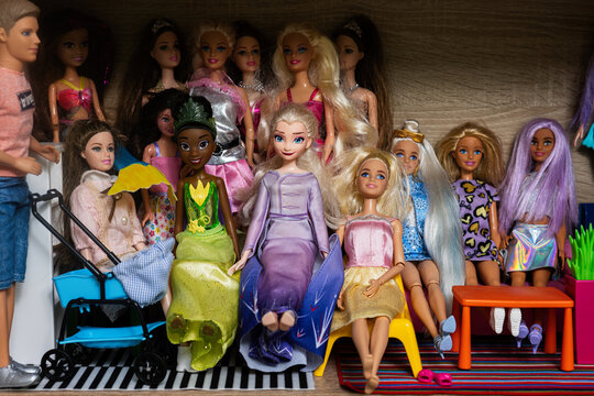 Ternopil, Ukraine - February, 2023: Closeup of Barbie dolls collection at home shelves.