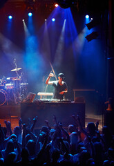 A DJ playing his live set to a group of screaming fans. This concert was created for the sole...