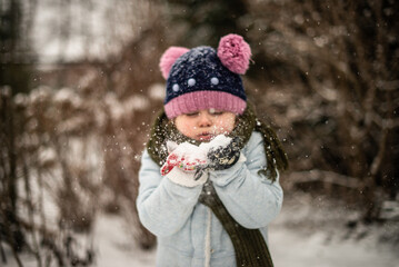 child playing with snow