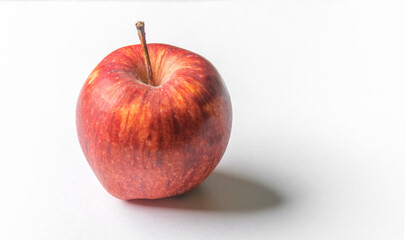 One apple fruit with white background and shadow. Used selective focus.