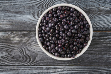 ripe whortleberry in a plate on the table