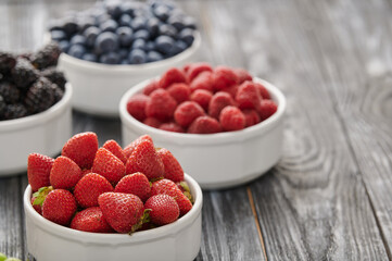 strawberries in a white bowl, shot close-up