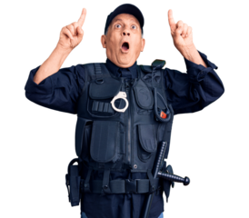 Senior handsome man wearing police uniform amazed and surprised looking up and pointing with fingers and raised arms.