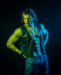 Fototapeta na wymiar Confident, attractive young man with open vest on