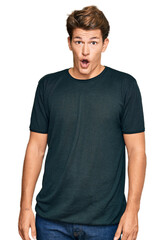 Handsome caucasian man wearing casual clothes afraid and shocked with surprise expression, fear and excited face.