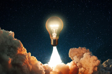 Creative rocket light bulb glows with smoke and blast successfully lift off into the starry sky...