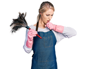 Beautiful young blonde woman wearing apron holding cleaning duster feeling unwell and coughing as symptom for cold or bronchitis. health care concept.