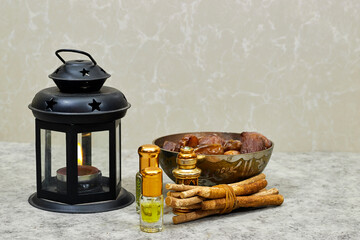 Mawlid al nabi or ramadan, eid concept. lantern with perfume and siwak  and dates fruit
