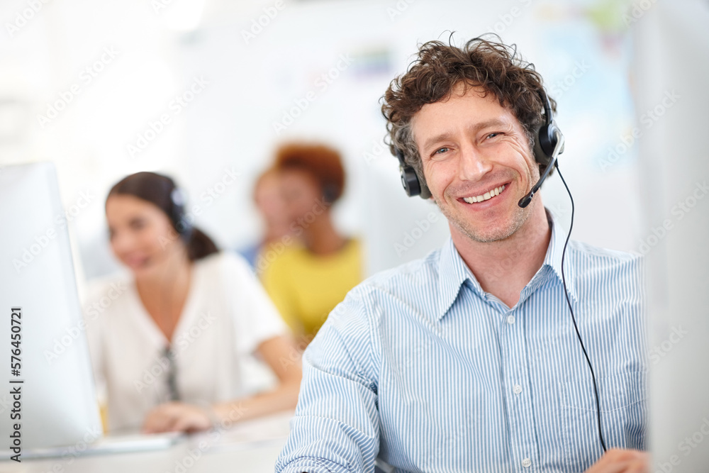 Poster were the call center you need. cropped portrait of a handsome call center operator in the office.