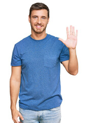 Fototapeta premium Handsome caucasian man wearing casual clothes showing and pointing up with fingers number five while smiling confident and happy.