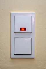 Many switches on a light wall.