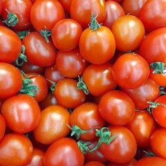 Bright ripe tomatoes close-up background.