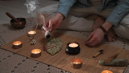 Man lighting incense for meditation and spiritual practice