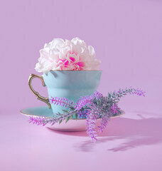 The Perfect Springtime Sip: A Pretty Cup of Floral Tea with Lavender Springs on a Pastel Green Saucer