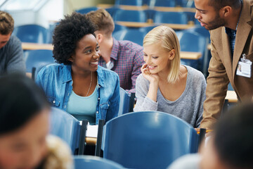 Getting ahead with her education. A gorgeous young student in the lecture hall.