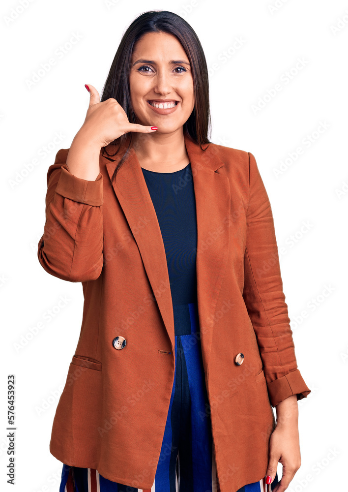 Sticker young beautiful brunette woman wearing elegant clothes smiling doing phone gesture with hand and fin