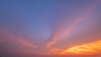 Sunset sky. Abstract nature background. Dramatic blue with orange colorful clouds in twilight time.