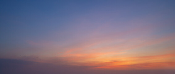 Sunset sky. Abstract nature background. Dramatic blue with orange colorful clouds in twilight time.