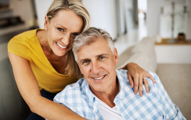 Fototapeta premium The only secret to a long marriage is love. Cropped shot of a loving mature couple relaxing at home.
