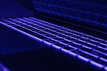 Keyboard laptop led backlight  lying on table in dark