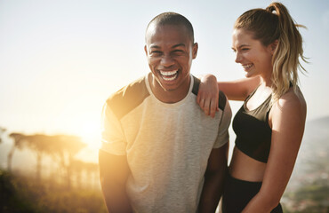 Shes my greatest fitness motivator. Shot of a fit young couple working out together outdoors. - Powered by Adobe
