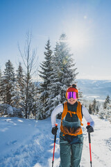 Mountaineer backcountry ski walking ski alpinist in the mountains. Ski touring in alpine landscape with snowy trees. Adventure winter sport. Kralova hola, Slovakia © Zedspider