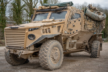 close-up of a British army Foxhound 4x4-wheel drive protected patrol vehicle with a broken rear axle, Wiltshire UK