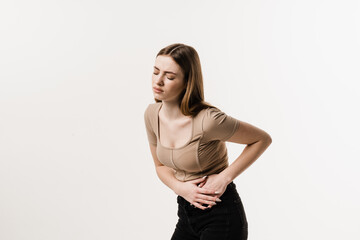 Girl with pelvic inflammatory disease on white background. PID infection of one or more of the upper reproductive organs, including the uterus, fallopian tubes and ovaries.
