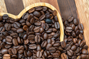 coffee beans in heart-shaped tra,y representing love of coffee