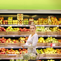 Woman buying fruits and vegetables at the market