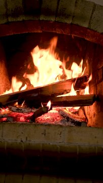 Cozy Relaxing Fireplace. TV Screen Saver. A Looping Clip of a Fireplace with Medium Size Flames Christmas Holidays Concept. Video for Meditation. High quality FullHD footage