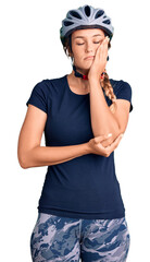 Beautiful caucasian woman wearing bike helmet thinking looking tired and bored with depression problems with crossed arms.