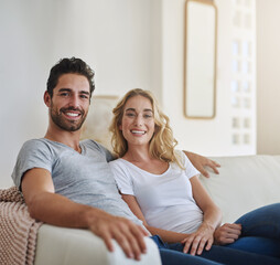 Lazy weekend in with my love. Shot of a young couple relaxing at home.