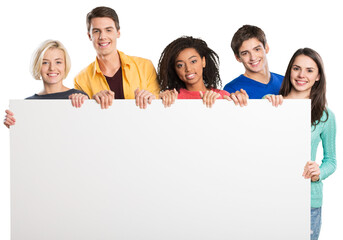 Group of diverse multiethnic happy young people posing with a blank white rectabgular sign with copyspace for your advertisement or text on a grey background