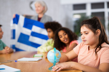 Kids learning together about greece in geography class