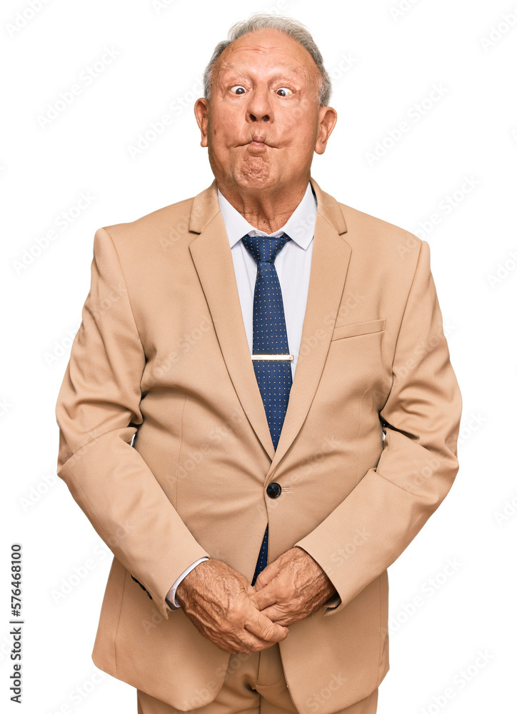 Sticker senior caucasian man wearing business suit and tie making fish face with lips, crazy and comical ges