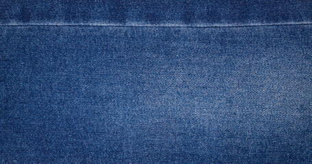 texture of blue jeans denim fabric with seam background