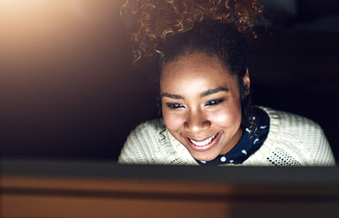 On night shift you make more money by the hour. Shot of a young businesswoman working late in her...
