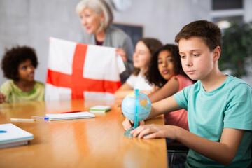 Kids learning together about england in geography class