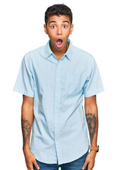Fototapeta premium Young handsome african american man wearing casual clothes afraid and shocked with surprise and amazed expression, fear and excited face.