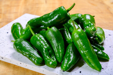 Fresh green mild padron pepper pementos, ready for grill or to be fried with olive oil, traditional...
