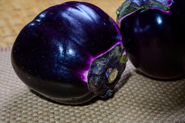 Fresh ripe sicilian purple globe Violetta eggplants vegetables ready to cook, healthy Italian food