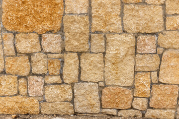 fragment of a stone wall of an Israeli old house. Large square stones