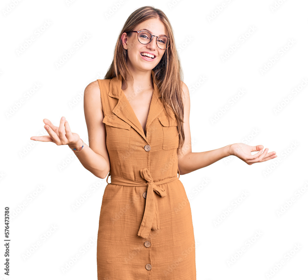 Sticker Young beautiful blonde woman wearing casual clothes and glasses smiling cheerful with open arms as friendly welcome, positive and confident greetings